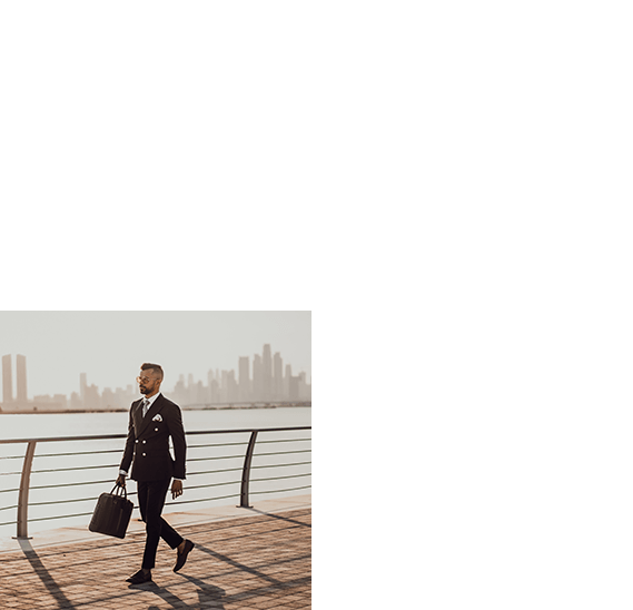 Business man walking on the bridge